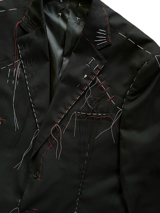 Giacca con cuciture e impunture fatte a mano a vista